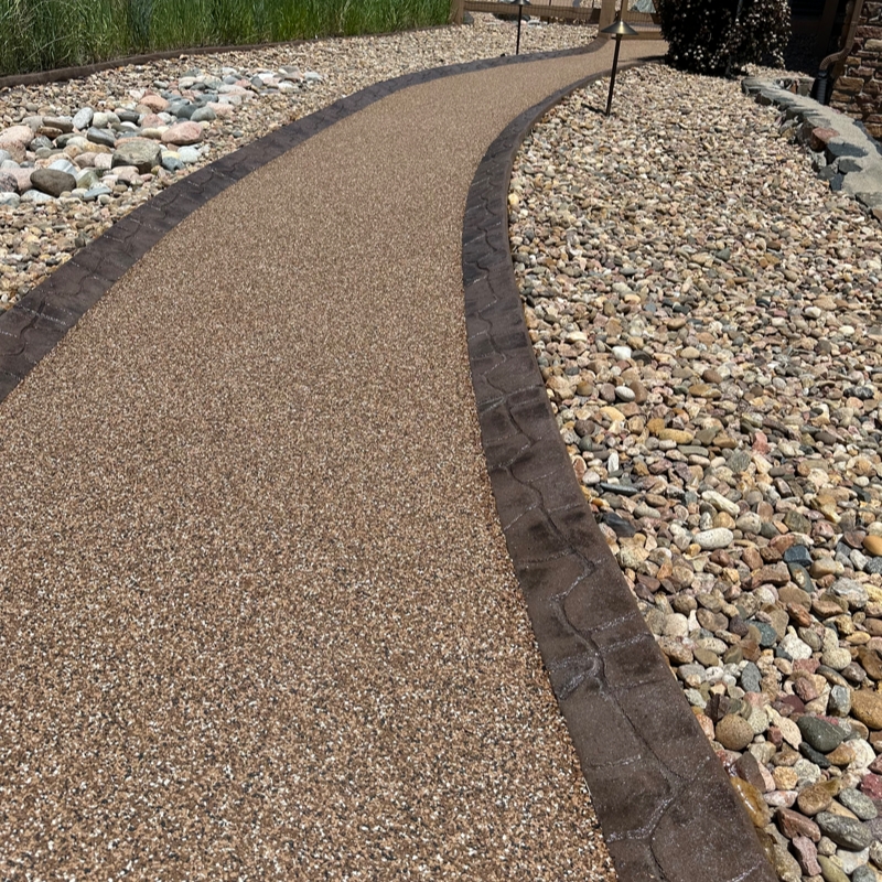 Curbmate USA Project photo 2 - Large Cobble and Rubber Mixture: 338 Leather